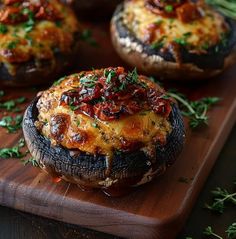 baked stuffed mushrooms with cheese and herbs on a cutting board, ready to be eaten