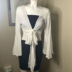 All The Summer Feels! Can Be Tied In Front Or Wrapped Multiple Times And Tied! Use As A Blouse Or Coverup! Boho Feels With Front Tie And Bell Sleeves. White Size Small Note: Sale Is Only For The Top. 1 Item. White Shirt Bell Sleeves, Spring Vacation Tops With Tie Waist, Summer Top With Tie Waist For Brunch, Spring Beach Tops With Tie Waist, Chic Wrap Crop Top For Beach, Tied Tops For Spring Vacation, Summer Tops With Tied Detail For Day Out, Summer Beach Wrap Crop Top, Spring Vacation Tied Top