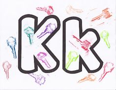 the letters k and b are drawn with colored crayon pencils on white paper