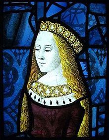 a stained glass window with a woman wearing a crown