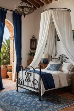 a bedroom with a canopy bed and blue curtains