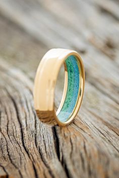 Product Details Ring Style: "Sedona" is a custom, handcrafted men's wedding ring featuring a raised center 14K gold band with a turquoise and malachite lining. Additional inlay options are available upon request. Width:The width of the ring pictured is approximately 7-8mm wide but can be ordered in a custom width for a small upgrade cost. Please state your desired width in the Notes to Seller section during checkout, and we will reach out to you for payment. Customizable:Because each ring is han Malachite Ring Men, Turquoise Men’s Wedding Ring, Luxury Men's Turquoise Ring With Polished Finish, Luxury Polished Turquoise Men's Ring, Artisan Turquoise Ring With Inlay, Luxury, Staghead Designs, Men's Wedding Ring, Detailed Ring, Ring Pictures