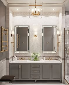 a bathroom with two sinks, mirrors and lights on the wall next to each other