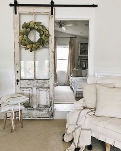 an open door leading to a bedroom with a wreath on it