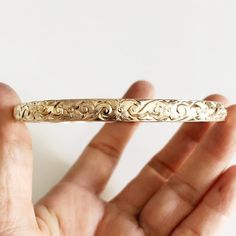 Traditional Hawaiian heirloom bangle is make with decorative floral pattern wire. Bangle is hand- formed, hammered and polished for a stunning texture and shine. It looks great worn alone or paired with other shell and charm bangles to create a chic, fun beachy look. Bangle is about 6mm wide 1.5 mm thick. Each bangle is custom made to order so can not be return or exchange for that reason. Please don't hesitate to contact me if you have any questions at all before ordering. PLEASE NOTE THERE IS Charm Bangles, Hawaiian Jewelry, Pearl Bangle, Jewelry Safe, Tahitian Pearls, Charm Bangle, Hand Crafted Gifts, Bangle Set, Pink Bracelet