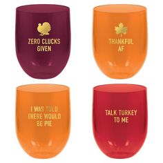 four wine glasses with different sayings on them