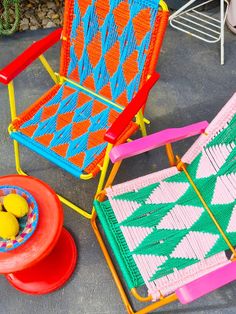 two colorful lawn chairs sitting next to each other