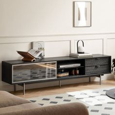 a living room with a black entertainment center