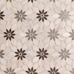 a white and brown flower pattern is on the wall