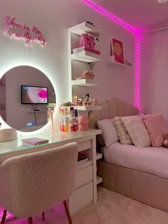 a bedroom with a bed, desk and pink lights on the wall behind it is a mirror that says happy new year