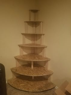 a large wooden shelf sitting on top of a carpeted floor