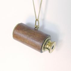 Expanding wood-encased telescope on long gold curb chain. The telescope works! Metal: Brass telescope, 14kt gold plate over brass on chain Size: 3" L telescope, 32" chain Lobster clasp Materials: wood, brass on working telescope Brass Chain Necklace, Compass Necklace, Brass Chain, 14kt Gold, Antique Brass, Chain Necklace, Silver Necklace, Gold Necklace, Gold Plate