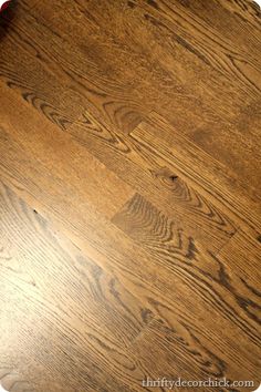 a wooden table top that has been cleaned and is brown with some wood grain on it