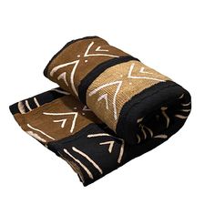 two brown and black towels folded on top of each other with arrows drawn on them