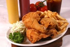 fried fish and fries on a white plate