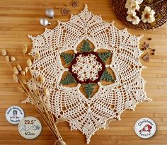 crocheted doily on wooden table with other items