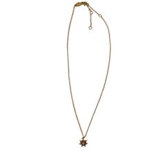 a gold necklace with a star charm hanging from it's center, on a white background