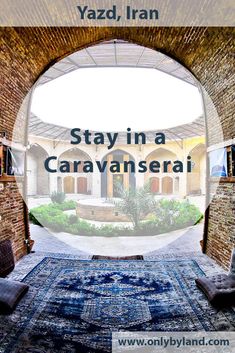 an arched doorway with the words stay in a caravanseri