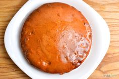 a round cake sitting on top of a white plate