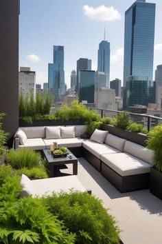 an outdoor living area with couches and tables in front of the cityscape