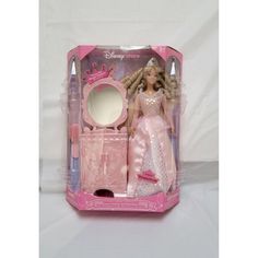 a barbie doll in a pink dress and hair accessory set with mirror, comb and brush