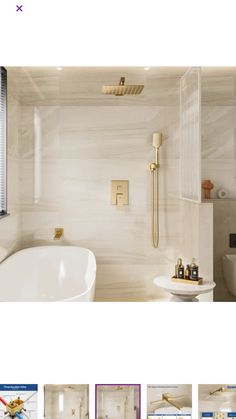 an image of a bathroom with white walls and gold fixtures on the tub, shower head, and sink faucet