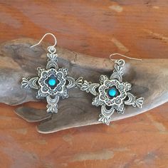 "Sterling Silver multi overlay with a framed 4-5mm turquoise. Approx. 1 1/2 x 1 1/2 inch in size. French wire dangle or post, vintage look. Turquoise will vary from photo. \"PRECIOUS METAL CREATIONS FROM THE HEART & SOUL OF SANTA FE\" © Copyright 2016 Santa Fe Silverworks by Gregory Segura - All rights reserved. All content, photos, artwork, descriptions, designs, etc. may not be used without our explicit permission. Each item is made when ordered unless otherwise stated so please allow up t Bohemian Turquoise Concho Earrings, Silver Drop Earrings With Patina, Silver Patina Drop Earrings, Sterling Silver Patina Earrings, Content Photos, New Mexico Usa, Native Style, French Wire, Southwestern Style