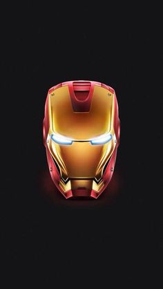 the iron man helmet is shown on a black background with light coming from it's eyes