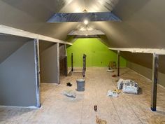 an empty room with paint and tools on the floor in preparation for remodeling