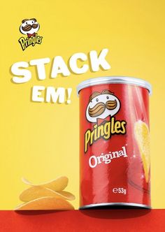 a can of pringles next to some chips