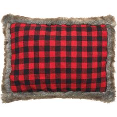 a red and black plaid pillow with fur trim