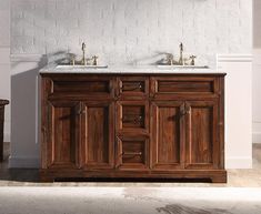 a bathroom vanity with two sinks in it