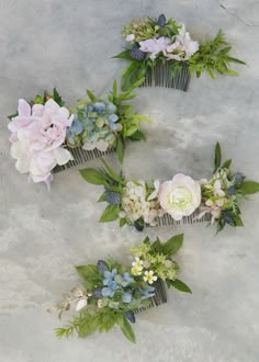 three hair combs with flowers and greenery on them