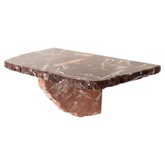 a marble table with a brown base on it's end, against a white background