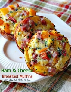 ham and cheese breakfast muffins on a white plate with a plaid tablecloth