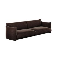 a brown couch sitting on top of a white wall