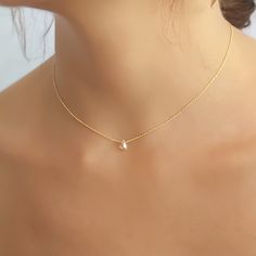 "Dainty gold necklace with Swarovski drop bead. Perfect to wear on its own or to layer with more necklaces of your collection. ⊹ D e t a i l s 7 mm Swarovski drop bead - Champagne color Micron Gold plated chain - Durable plating, safe to use in regular water ⊹ L e n g t h 14\" + 2\" extender chain ⊹ Read about my shop Processing and Delivery times, Payment options, Packaging and Care instructions here: https://www.etsy.com/il-en/shop/annikabella#more-section" Short Gold Necklace, Minimalist Gold Necklace, Tiny Gold Necklace, Gold Minimalist Jewelry, Prom Necklaces, Minimalist Necklace Gold, Delicate Gold Necklace, Perfect Gift For Girlfriend, Gold Necklace Simple