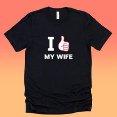 "This I Love My Wife Shirt is the perfect gift or present for any woman or man who loves My Wife. If you are a My Wife Lover, this tee is perfect for you. Get a laugh with this funny Smile Face Shirt. This Happy Face Shirt is for Women or men. You are buying a custom I love you shirt for anyone. This classic popular shirt fits like a well-loved favorite. Soft cotton and fun graphics make it a perfect gift. These t-shirts have ribbed knit collars to bolster shaping. Perfect shirt for Birthday Pre I Love My Wife Shirt, Happy Face Shirt, I Love My Husband, Fun Graphics, Viking Shirt, Love My Wife, Presents Christmas, Husband Shirts, Popular Shirt