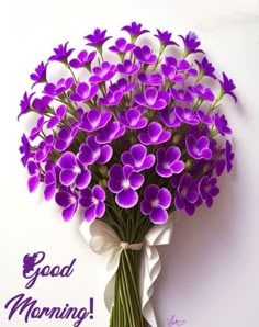 a bouquet of purple flowers with the words good morning