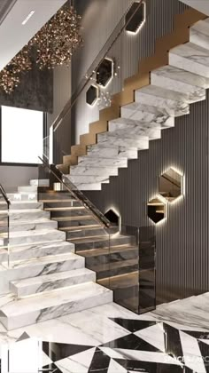 an elegant staircase with marble steps leading up to the second floor