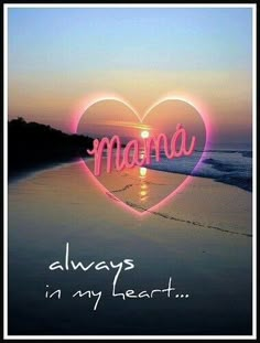 a heart with the word mama written in it and an image of a beach at sunset