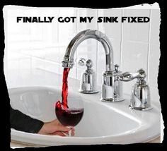 a woman is drinking from a faucet that has been filled with red liquid