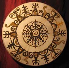 a white and gold plate with designs on it