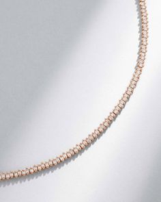 A stunning blend of elegance and modern sophistication, this tennis necklace features an exquisite row of princess-cut white diamonds. Each diamond catches the light from every angle, creating a radiant sparkle, perfect for both day and evening wear. Details 18k yellow gold, rose gold or white gold 3.25 carats of 1.5x1.5mm princess-cut white diamonds Necklace measures 17" inches in length Box clasp with safety lock fastening 3mm width Ref: BAP705D Elegant Rose Gold Diamond Necklace With Sparkling Stones, Elegant Rose Gold Tennis Necklace With Diamond Accents, Elegant Tennis Necklace With Baguette Diamonds As Gift, Rose Gold Tennis Necklace With Diamond Accents, Elegant Rose Gold Tennis Necklace For Gifts, Rose Gold Diamond Tennis Necklace For Formal Occasions, Luxury Cubic Zirconia Tennis Necklace With Baguette Diamonds, Elegant Baguette Diamond Tennis Necklace Gift, Classic Rose Gold Tennis Necklace For Formal Occasions