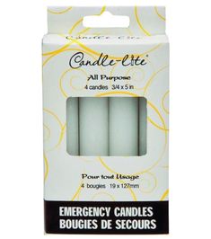 three candles in white packaging with yellow swirls on the front and bottom, one is empty