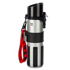 a stainless steel and black coffee pot with a red strap around it's neck