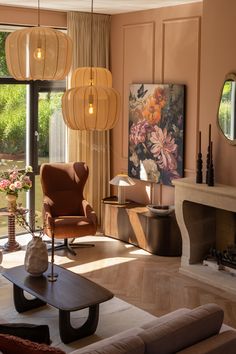 a living room filled with lots of furniture next to a fire place and large windows