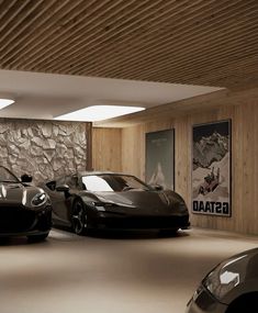 two black sports cars in a garage with stone wall and wood paneling on the walls