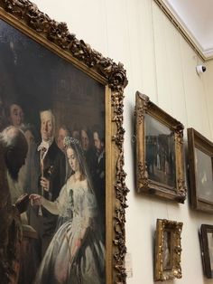 a large painting hanging on the side of a wall