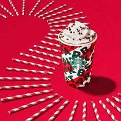 starbucks's happy new year drink with sprinkles around it on a red background